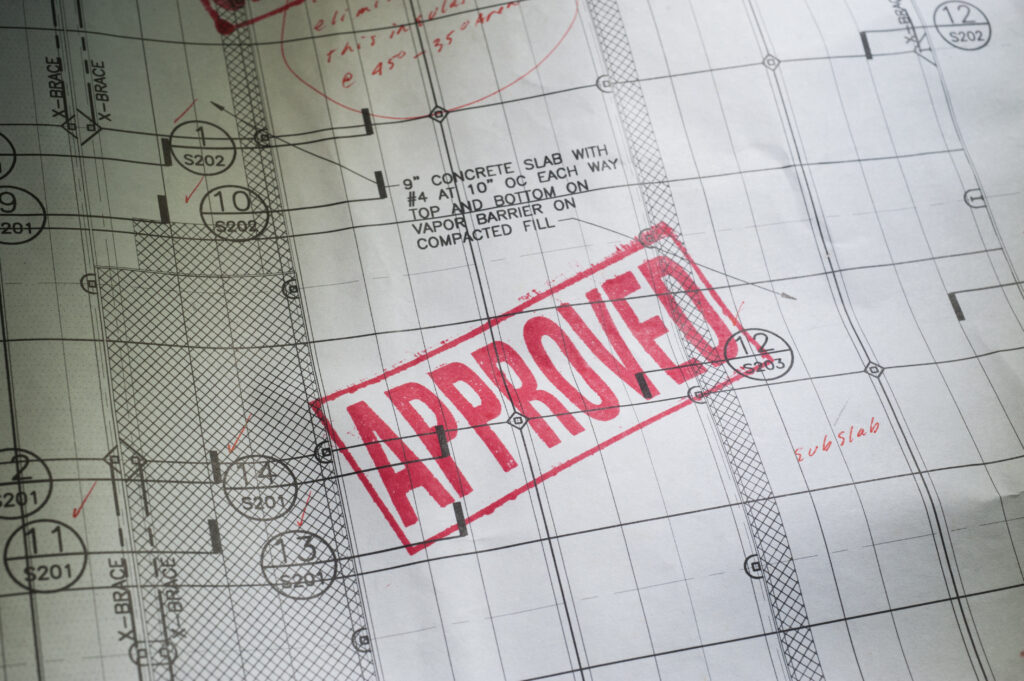 Blueprint with the word APPROVED stamped in red